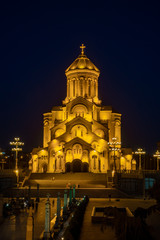 Fototapeta na wymiar Famous Orthodox Holy Trinitiy Sameba church illuminated with golden light.