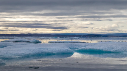 Naklejka na ściany i meble Glacier lagoon and icebergs on Peel Sound, a waterway situated in Prince of Wales island at the Northwest Passage in Canada.