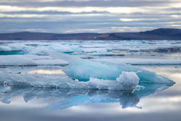 Obraz premium Glacier lagoon and icebergs on Peel Sound, a waterway situated in Prince of Wales island at the Northwest Passage in Canada.