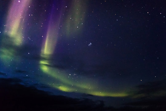 Northern Boreal Lights in the sky while sailing across the northwest passage in Canada.