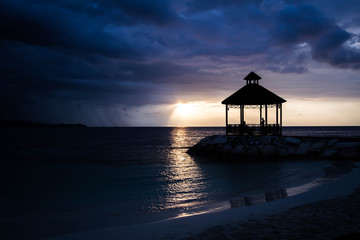 Silhouette of gazebo with colorful sunset