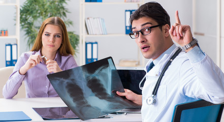 Doctor examining x-ray images of patient