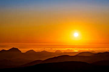 Sunset in the Mountains, orange sun