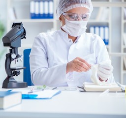 Female scientist researcher conducting an experiment in a labora