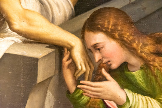 Detail of medieval painting showing Mary Magdalene kissing Jesus´s hand