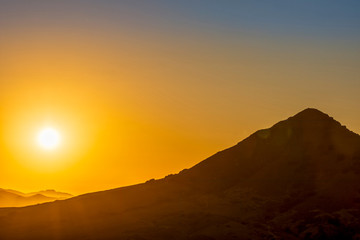 Setting Sun, Silhouetted Hill, Peak, Mountain