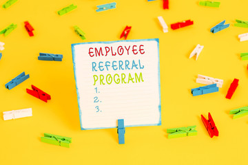 Handwriting text Employee Referral Program. Conceptual photo employees are rewarded for introducing recruits Colored clothespin papers empty reminder yellow floor background office