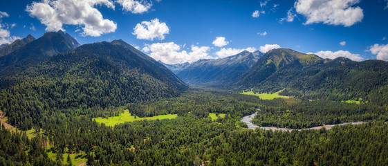 Panoramic nature mountains landscape in the summer day. Aerial drone view from above