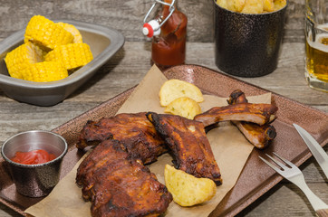 Smoked barbecue pork spare ribs and rustic fries