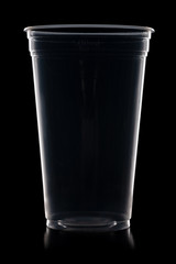 Disposable plastic cup isolated on black background