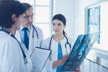 Group of doctors checking x-rays in a hospital