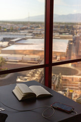 book on top of a table by the window. 
