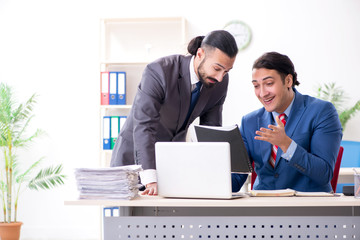 Two male colleagues in the office