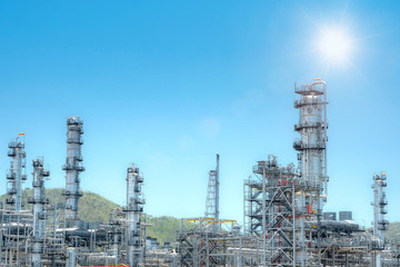 Oil and gas industrial,Oil refinery plant form industry,Refinery factory oil storage tank and pipeline steel with sunset and cloudy sky background,Thailand