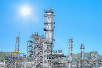 Oil and gas industrial,Oil refinery plant form industry,Refinery factory oil storage tank and pipeline steel with sunset and cloudy sky background,Thailand
