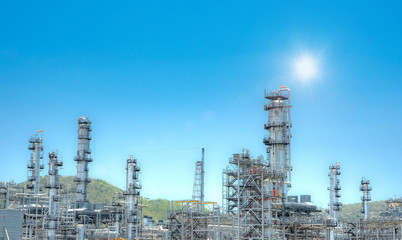 Oil and gas industrial,Oil refinery plant form industry,Refinery factory oil storage tank and pipeline steel with sunset and cloudy sky background,Thailand