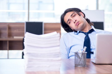 Young employee unhappy with excessive work