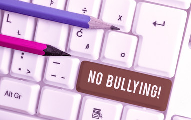 Conceptual hand writing showing No Bullying. Concept meaning stop aggressive behavior among...