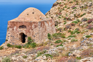 Old ancient ruins of abandoned building on islands near Crete, Greece.