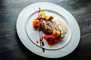 delicious sliced baked meat with grilled vegetables