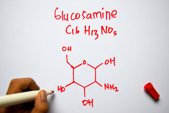 Glucosamine (C16,H13,NO5) molecule written on the white board. Structural chemical formula. Education concept