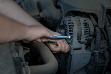 mechanic at work, maintenance on a truck engine