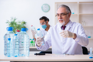 Two chemists working in the lab