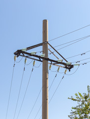 Power lines with concrete pillar on a sunny day (high voltage tower)\