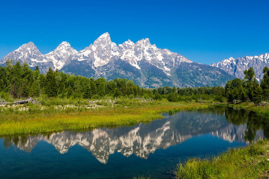 The Tetons reflected in the Snake River at Schwabacher Landing in Grand Teton National Park, Wyoming © Paul