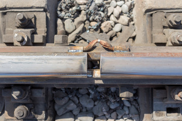 Old railway line. Connecting metal railway rails.