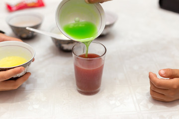 multi-colored sweets dissolve in water, all paints and harmful substances fall into the water, it is dangerous for children and for humans