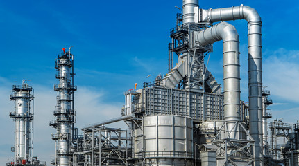 Oil and gas industrial,Oil refinery plant form industry,Refinery factory oil storage tank and pipeline steel with sunset and cloudy sky background,Thailand