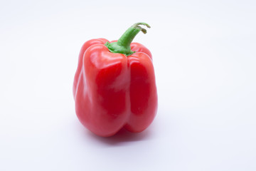 Red  sweet bell pepper on a white background, selective focus