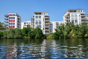 Fototapeta na wymiar Modern apartment houses at the river Spree in Berlin, Germany