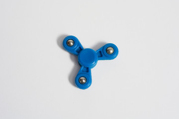 Fidget spinner on isolated background. Fashion toy to calm anxiety and lack of attention