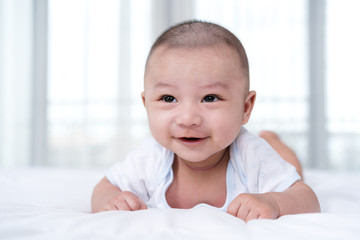 happy baby on a bed