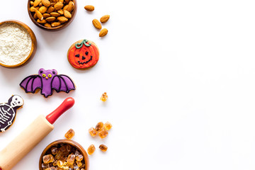 Cook halloween gingerbread cookies on white background top view copyspace