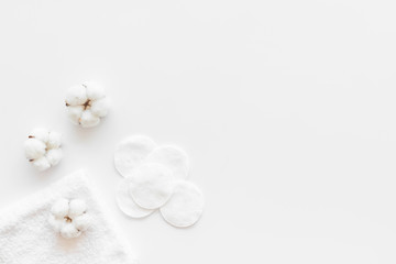 Cotton flowers with pads on white background top view mock up
