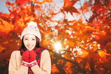 asian Young woman with autumn leaves background