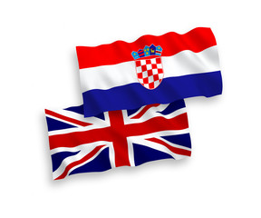 National vector fabric wave flags of Great Britain and Croatia isolated on white background. 1 to 2 proportion.