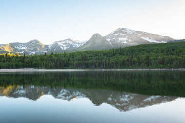 Mountains reflecting in Silver Lake Flat Reservoir, on the Alpine Loop Scenic Byway, in Uinta-Wasatch-Cache National Forest, Utah