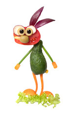 Funny vegetable hare standing on salad leaf