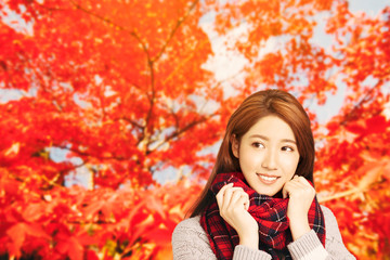 asian Young woman with autumn leaves background