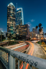 Cityscape skyline view of the 110 Freeway at night in downtown Los Angeles, California