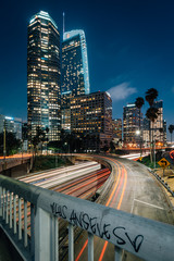 Fototapeta na wymiar Cityscape skyline view of the 110 Freeway at night in downtown Los Angeles, California