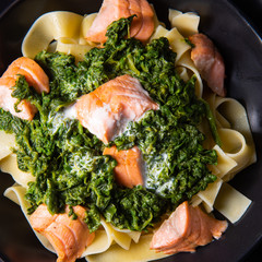 pappardelle pasta with creamed spinach and fried salmon