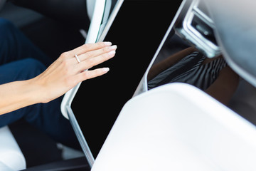 Top view of businesswoman using navigator in the car