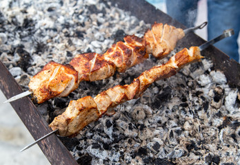 Barbecue skewers grilled on charcoal