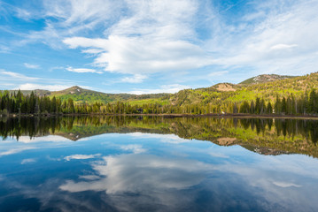 Obraz na płótnie Canvas Reflections of mountains at Silver Lake, in Uinta-Wasatch-Cache National Forest, in Brighton, near Park City, Utah