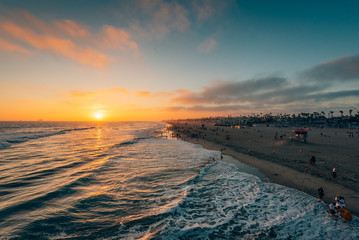 Sunset over the beach from the pier in Huntington Beach, Orange County, California